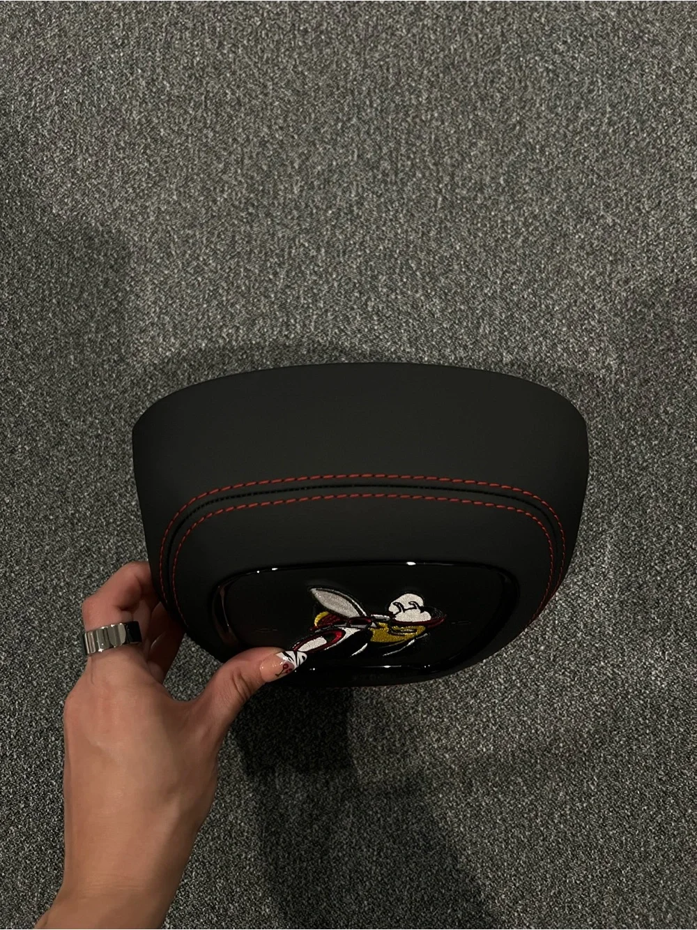 Black Airbag Cover with Red Stitching and Bee Patch